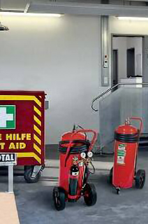 Fire extinguishers and first aid kit in a warehouse